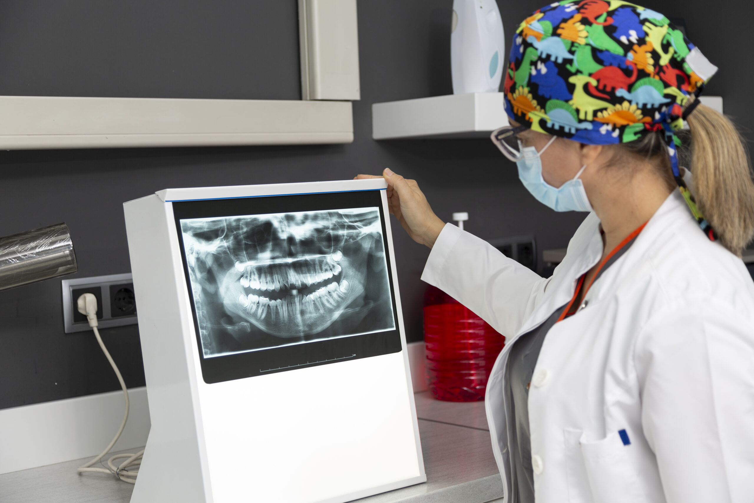 Female dentist viewing a dental x-ray of a patient